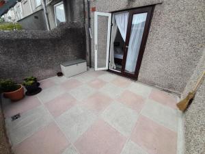 an open door of a building with a patio at City centre apartment with south facing patio close to the harbour in Plymouth