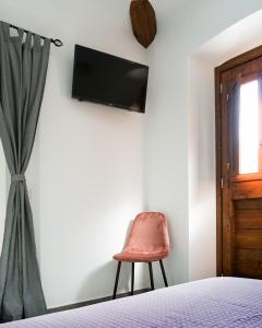 TV a/nebo společenská místnost v ubytování La Terrazza Azzurra