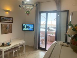 A television and/or entertainment centre at Residence Massilor