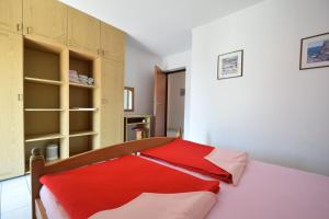 Tempat tidur dalam kamar di Apartments Jole