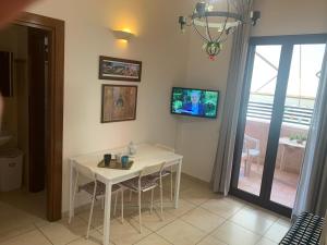 A television and/or entertainment centre at Residence Massilor