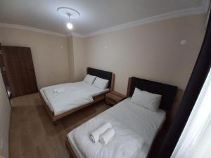 Ein Bett oder Betten in einem Zimmer der Unterkunft Kıvanç Residence