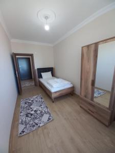 Ein Bett oder Betten in einem Zimmer der Unterkunft Kıvanç Residence