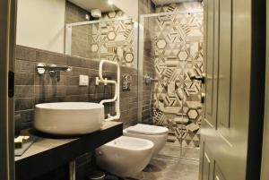 a bathroom with a white toilet and a sink at Locanda San Tomaso Affittacamere in Pietra Ligure +46 photos