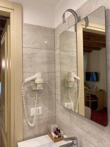a bathroom with a mirror and a sink at Locanda Ca' Zose in Venice +58 photos