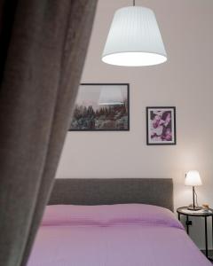 A bed or beds in a room at La Terrazza Azzurra