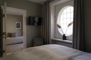 Postel nebo postele na pokoji v ubytování Savoy Hotel
