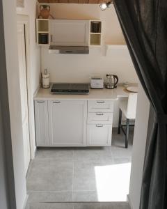 A kitchen or kitchenette at La Terrazza Azzurra