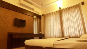 Katil atau katil-katil dalam bilik di Hotel Sai Ramanand