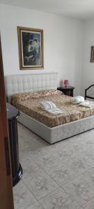 Posteľ alebo postele v izbe v ubytovaní Mary Home 1 a pochi passi dalla Reggia di Caserta