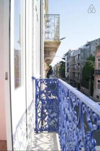 a blue railing on a balcony of a building at GuestReady - Oporto Sunset Blue Balcony in Porto