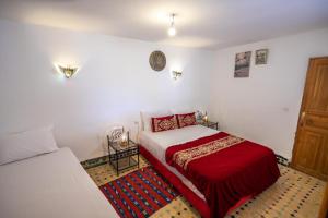 Postel nebo postele na pokoji v ubytování Riad Fes Iline