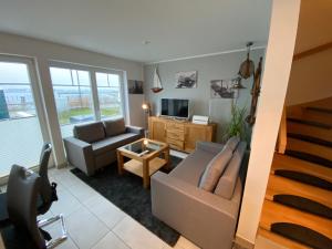 Posezení v ubytování Ferienhaus Captains Hus