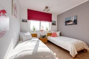 Postel nebo postele na pokoji v ubytování Ferienhaus Captains Hus