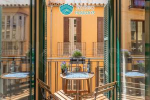A balcony or terrace at SkySea Holidays CITY CENTER SUITES