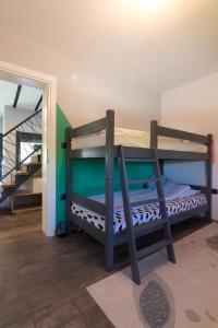 a bedroom with two bunk beds and a staircase at Modern House in Visoko in Visoko +37 photos