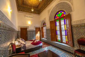 Postel nebo postele na pokoji v ubytování Riad Fes Iline