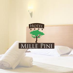 a sign that reads hotel milk pint with a tree on a bed at Hotel Mille Pini in Ginosa Marina