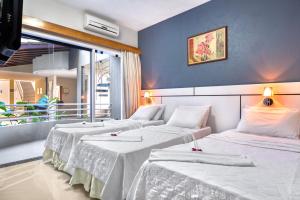 Postel nebo postele na pokoji v ubytování Hotel Porto Napolis + 37 fotografií