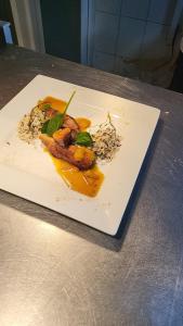 a plate of food sitting on a table at Bucharest Great Luxury ApartHotel ParkLake in Bucharest