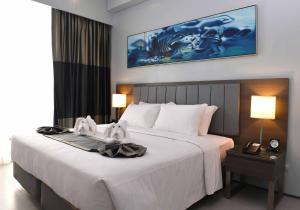 Voodi või voodid majutusasutuse Bayfront Hotel Cebu North Reclamation toas