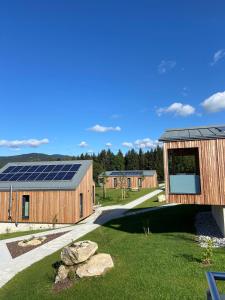 a house with solar panels on the side of it at Waidlerland Chalet "Natur" in Mauth