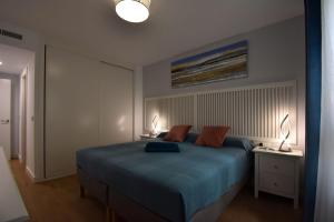 Łóżko lub łóżka w pokoju w obiekcie MAGNOLIO APARTMENT CALACEITE