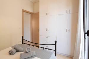 Postel nebo postele na pokoji v ubytování Agapi's Place