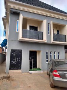a house with a car parked in front of it at 2 bedroom service apartment with full services in Idimu