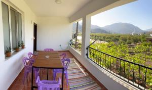 a balcony with a table and chairs and a view at Kapukargın apart villa in Dalaman