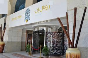 a lobby of a building with a sign on it at Nozol Royal Hotel in Medina