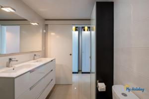 a bathroom with a sink and a mirror at Esther's Sea View in Playa del Ingles