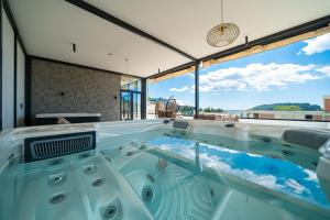 a hot tub in a house with a view at Hotel Millennium by Aycon in Budva