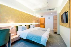 Postel nebo postele na pokoji v ubytování Hotel Console