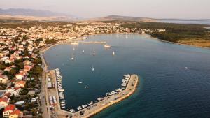 an aerial view of a harbor with boats in the water at Apartment Chillout House Novalja in Novalja