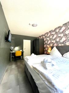 Postel nebo postele na pokoji v ubytování DUA Hotel