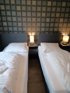 Postel nebo postele na pokoji v ubytování DUA Hotel