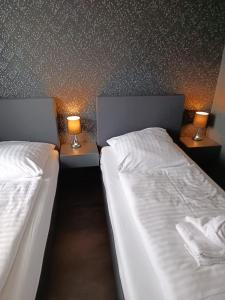 Postel nebo postele na pokoji v ubytování DUA Hotel
