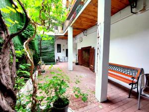 a bench sitting on a patio in a building at Casa Roth in Braşov