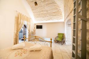 a bedroom with a bed in a room at Trullo Antica Bellezza in Alberobello