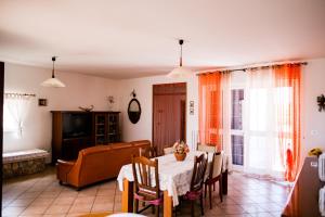 a living room with a table and a couch at TRULLO ELVIRA & LUIGI in Monopoli