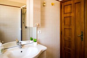 a bathroom with a sink and a mirror at TRULLO ELVIRA & LUIGI in Monopoli +43 photos