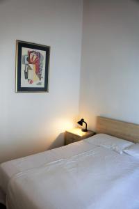 Posteľ alebo postele v izbe v ubytovaní Appartamenti Ferrari Residence