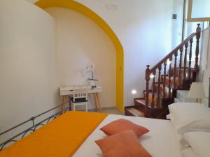 Postel nebo postele na pokoji v ubytování Mezza Torre B&B