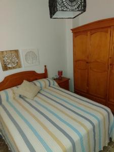 A bed or beds in a room at Apartamento Rey Melchor