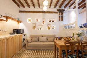 a living room with a couch and a table at Nisos Villa Olympos Karpathou in Olympos