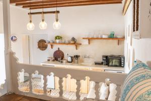 a kitchen with a sink and a counter top at Nisos Villa Olympos Karpathou in Olympos