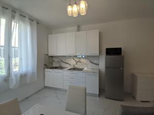 Kuchyň nebo kuchyňský kout v ubytování Villa Cortina + 11 fotografií