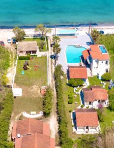 an aerial view of a house next to the beach at Villa Yiannitsis-Harmony In The Flowers, Acharavi Beach in (( Litherés ))