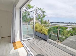 a balcony with a view of the water at West View, Emsworth in Emsworth